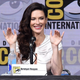 Bridget Regan waves at fans from the stage during a San Diego Comic-Con Panel.
